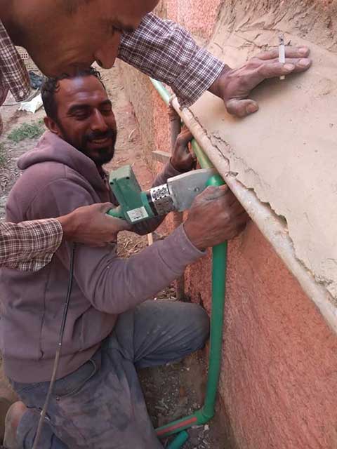 Rescuer building shelter in Egypt.