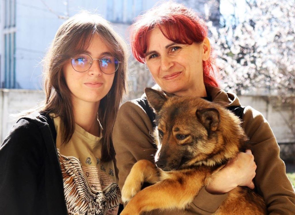 Romanian animal rescuers with dog