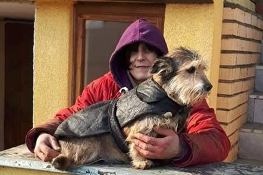 Rescuer with her terrier with winter coat.