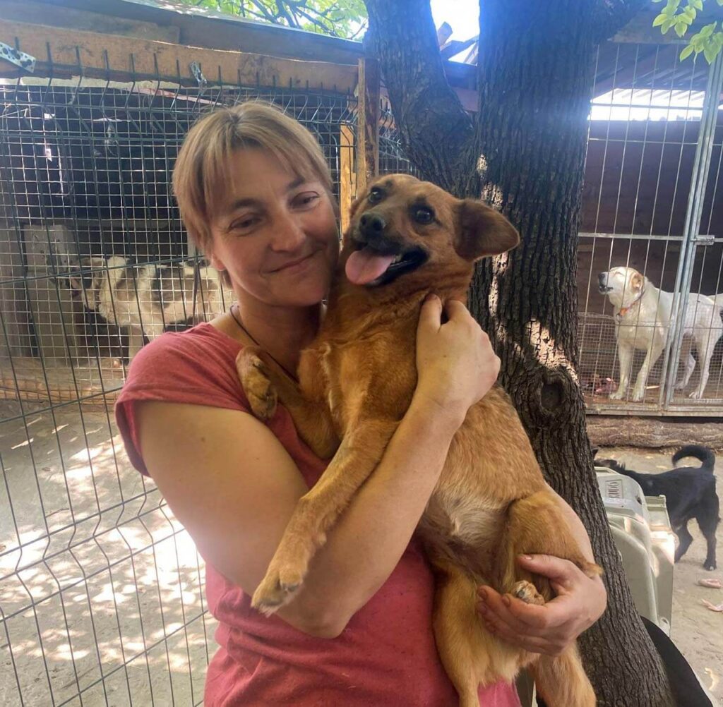 Ukranian Rescuer holding dog